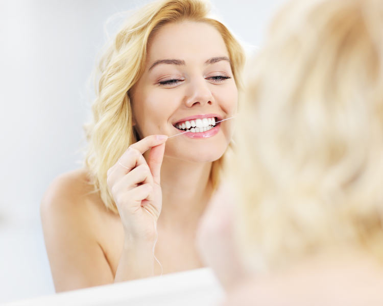 woman flossing